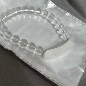 PULSERA CUENTAS REDONDAS Y UNA ALARGADA TRANSPARENTE